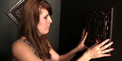 Emma Ash sucks it at the gloryhole confessional