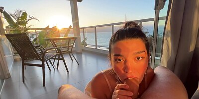 Hot Brunette sucks dick at Sunset on a Balcony
